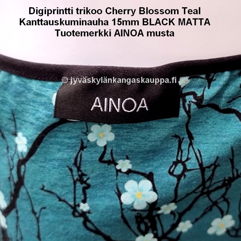 Digiprintti trikoo Cherry Blossom Teal ja Kanttauskuminauha 15mm BLACK MATTA sek&auml; Tuotemerkki AINOA musta